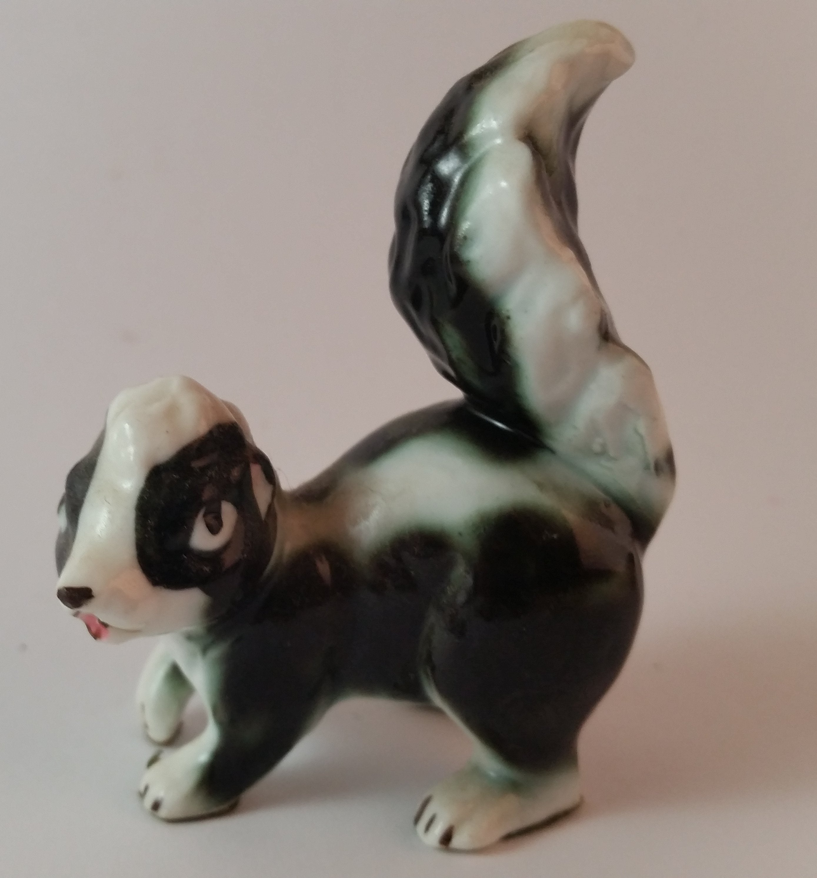 Vintage Porcelain Skunk Figurine with Tongue Out