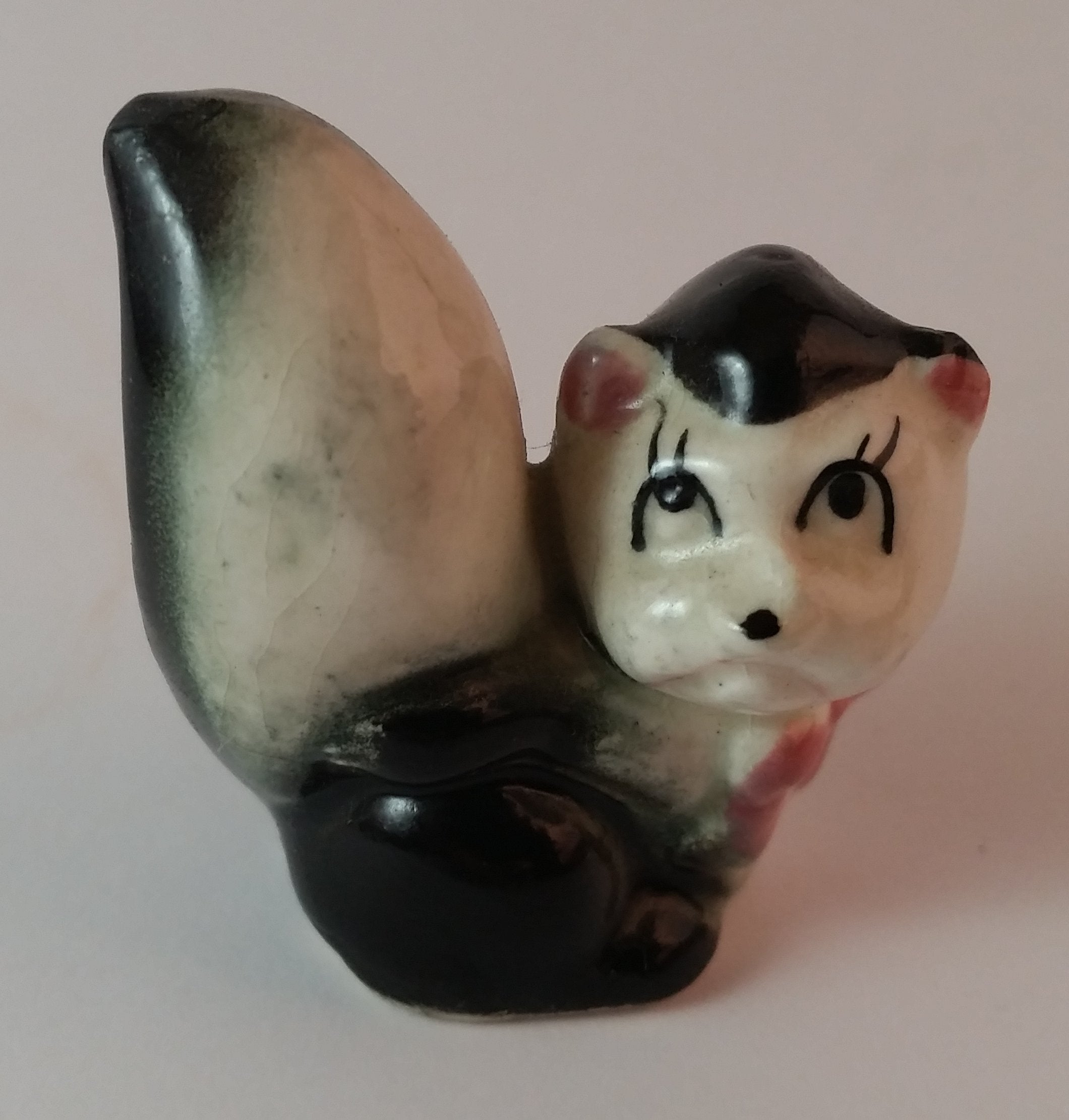 Vintage Girl Eye Lashed Skunk with Pink Bow Figurine Looking Upwards
