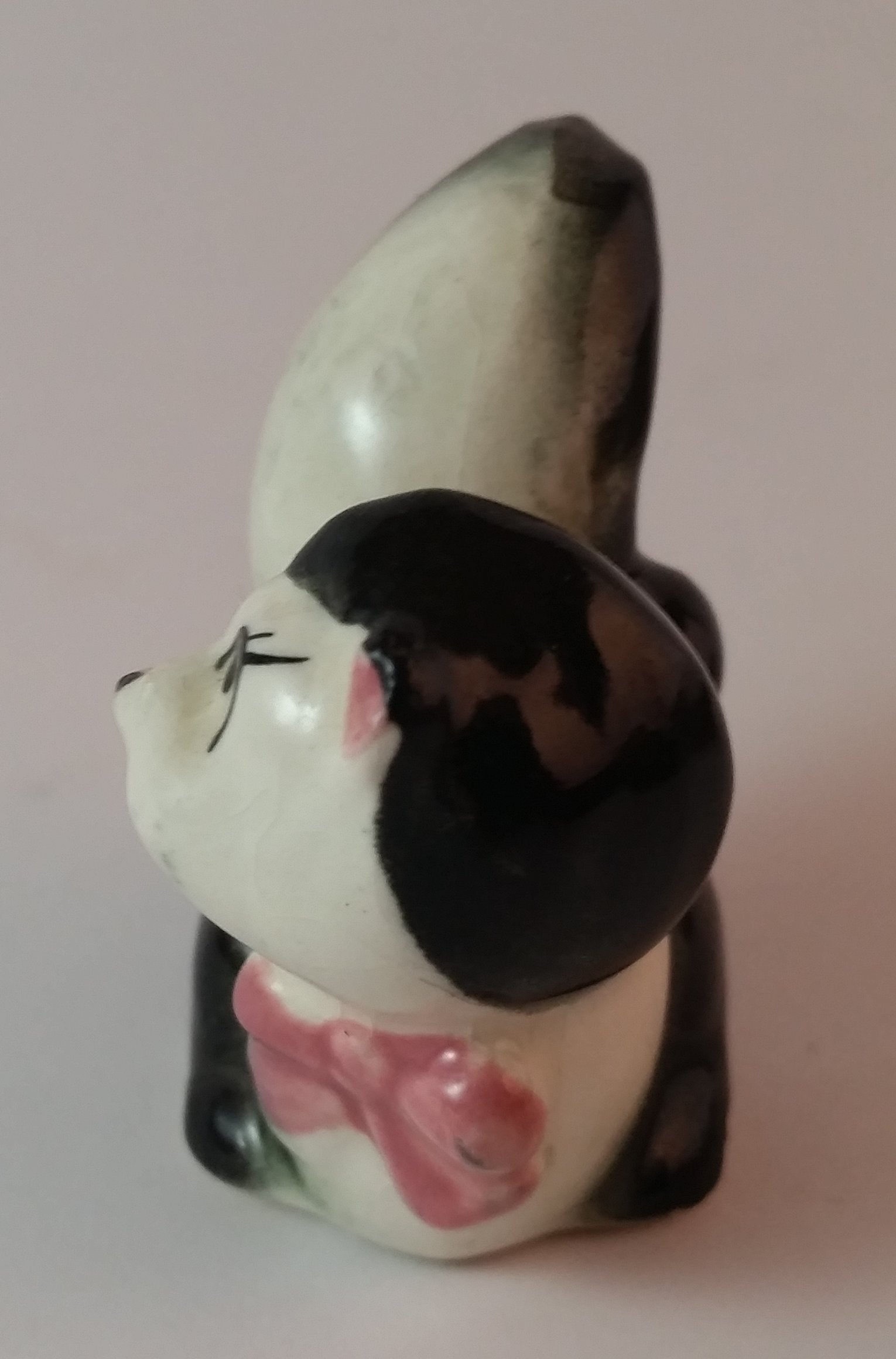 Vintage Girl Eye Lashed Skunk with Pink Bow Figurine Looking Upwards 2
