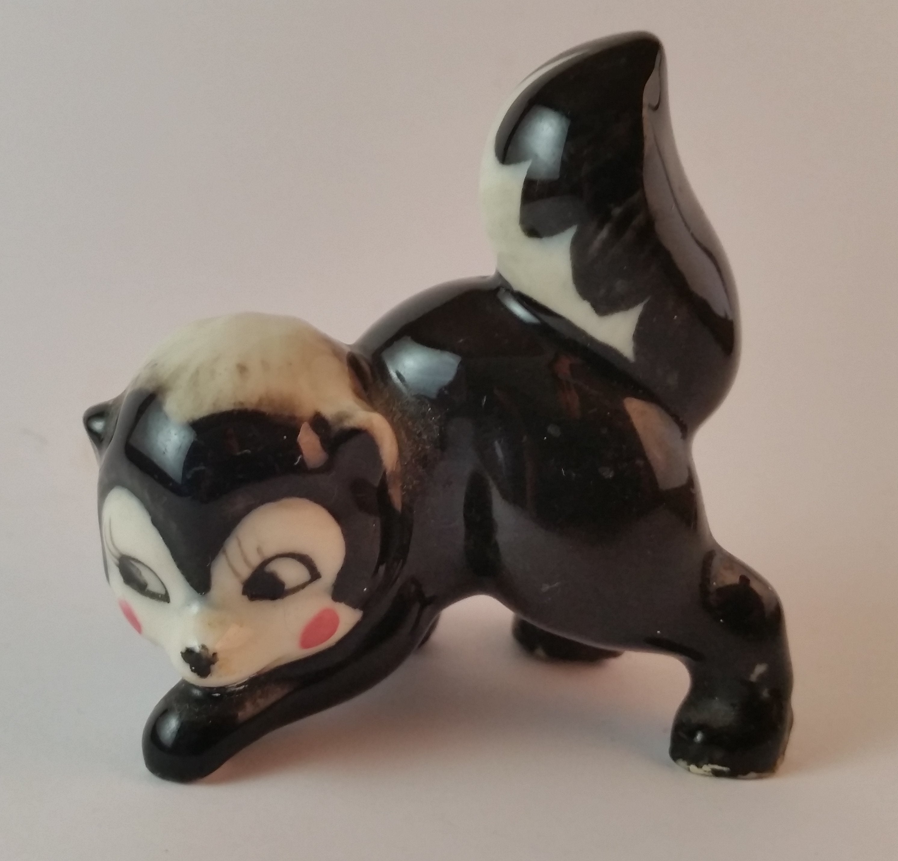 Vintage Porcelain Ceramic Playful Skunk Figurine