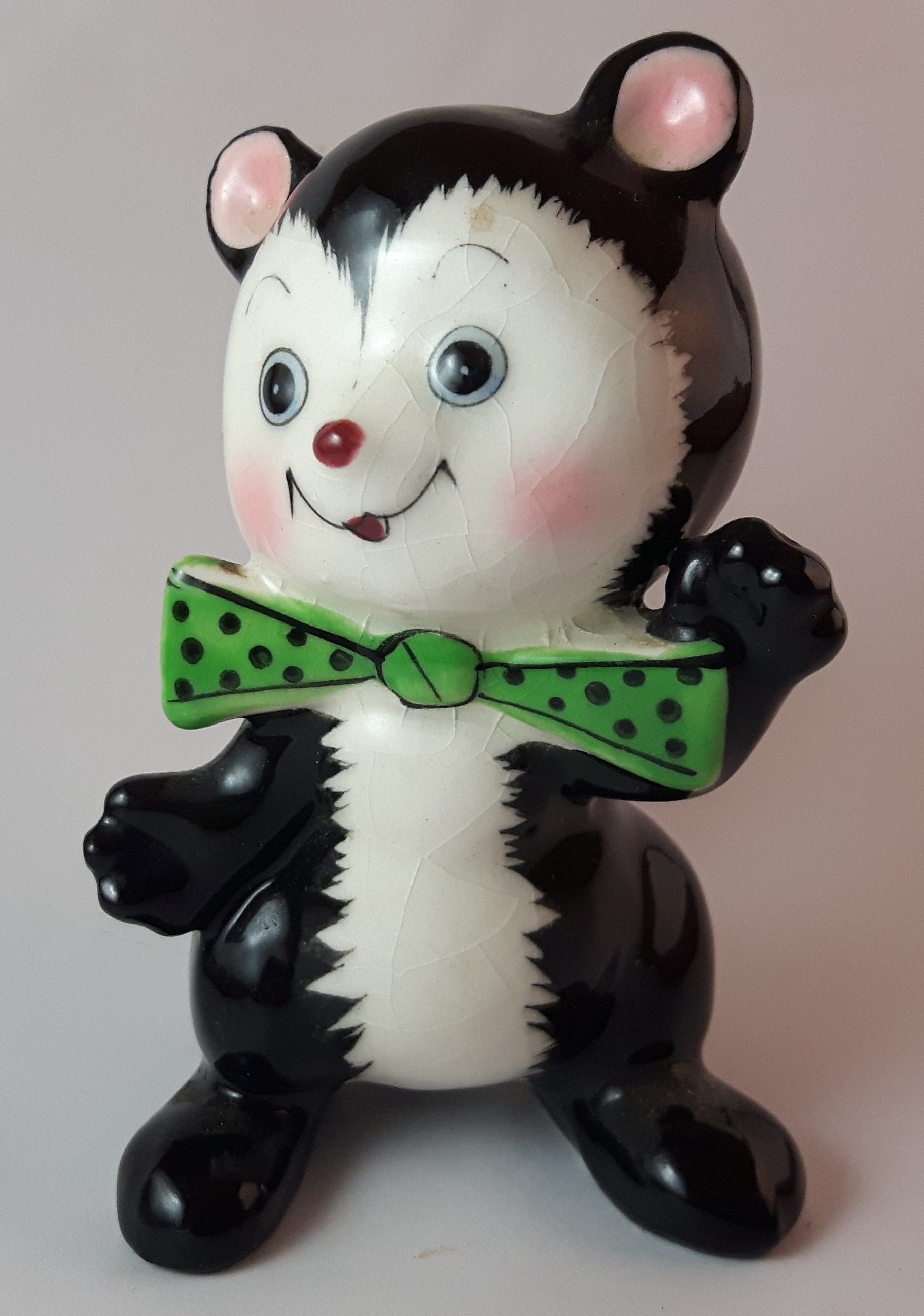 1950s Blushing Skunk with Green Polka Dot Bow Tie