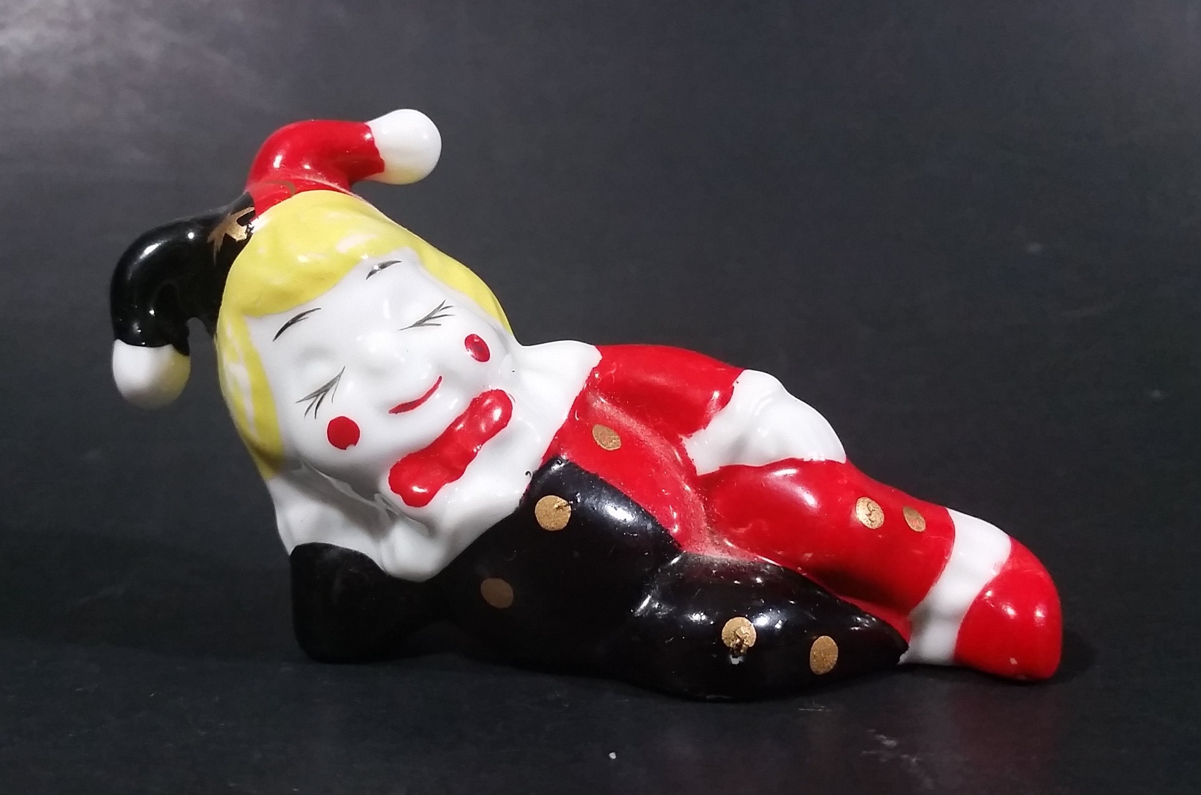 Decorative Ceramic Jester Laying Down Sleeping Dreaming Figurine w/ Red & Black Costume