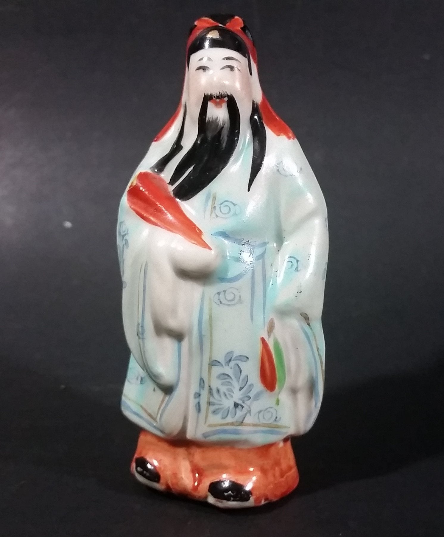 Vintage Chinese Wiseman in a Light Blue Robe with Red Item in Hand Figurine