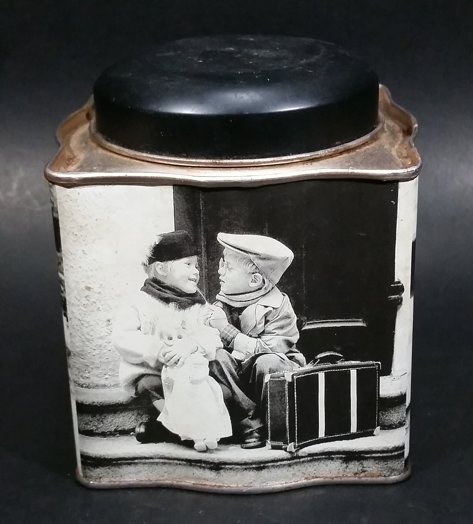 Black and White Photograph Cocoa Storage Tin of a Boy and a Girl Sitting in Different Scenes