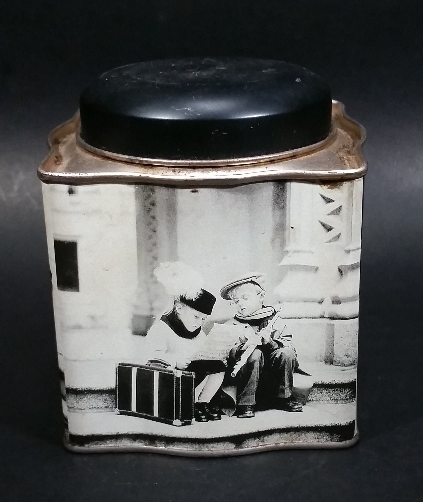 Black and White Photograph Cocoa Storage Tin of a Boy and a Girl Sitting in Different Scenes 3