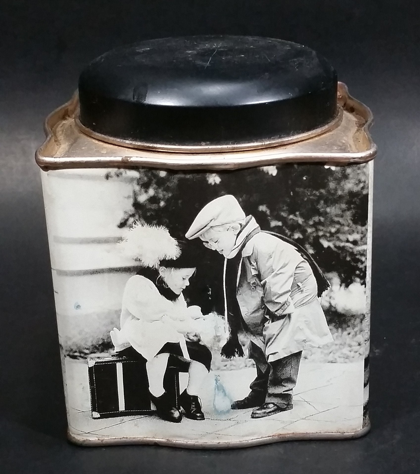 Black and White Photograph Cocoa Storage Tin of a Boy and a Girl Sitting in Different Scenes 7