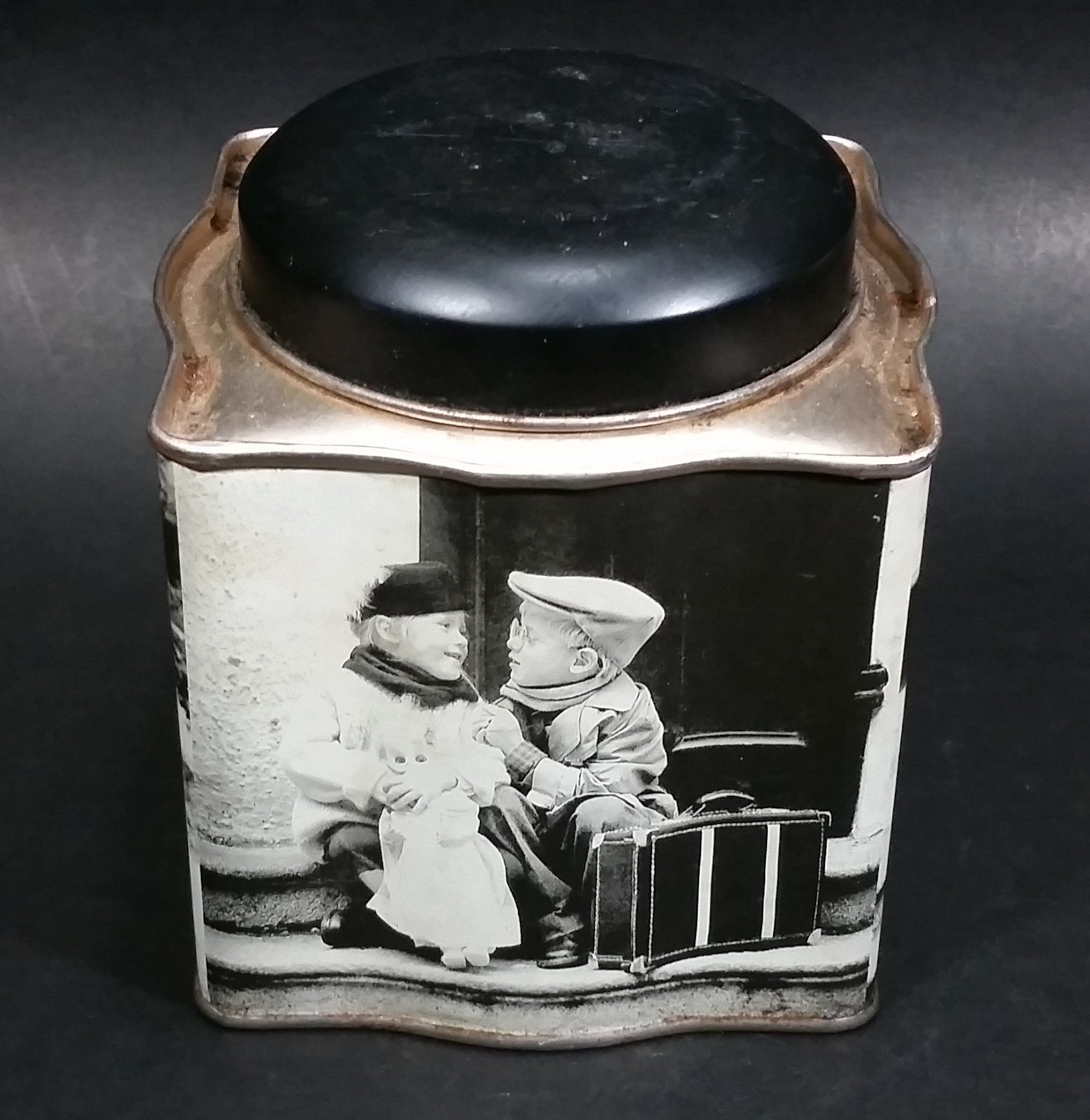 Black and White Photograph Cocoa Storage Tin of a Boy and a Girl Sitting in Different Scenes 9