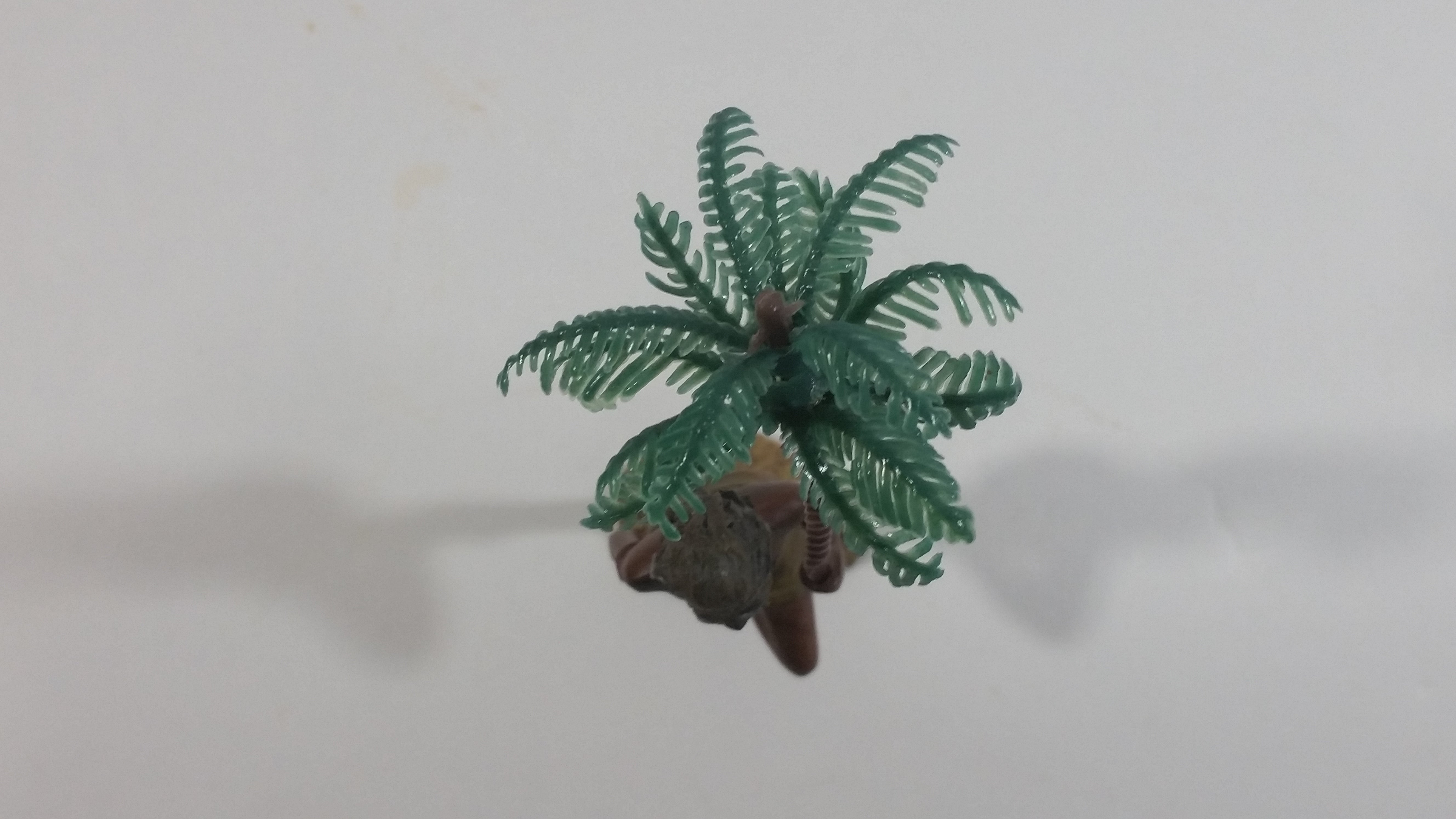 Man Holding a Palm Tree Umbrella While Standing on One Foot Resin and Plastic Figurine 6