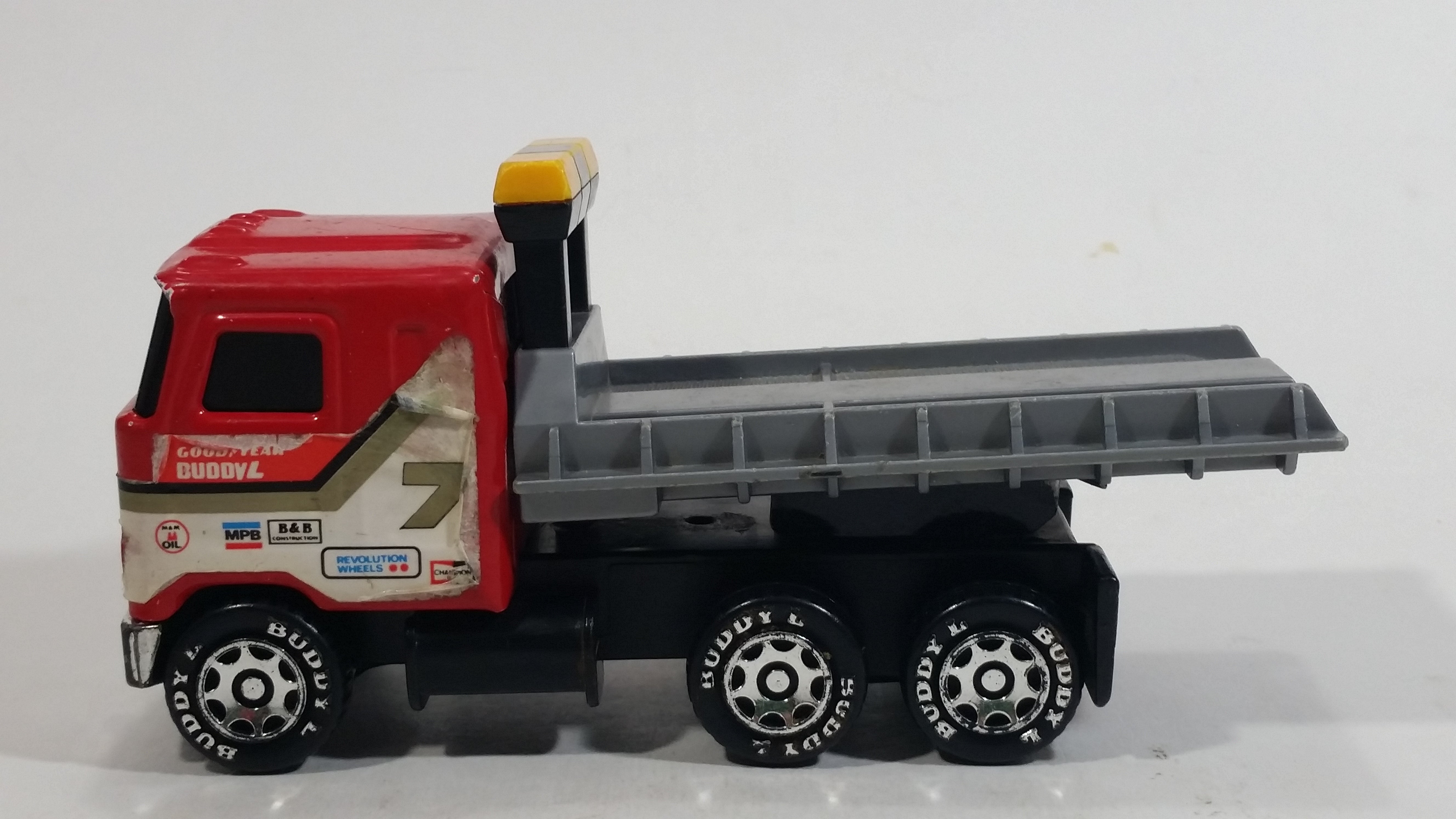 Vintage 1980 Buddy L Mack Semi Good Year #7 Flatbed Tow Truck Red and Grey Pressed Steel and Plastic Toy Car Wrecking Salvage Vehicle - Macau 1
