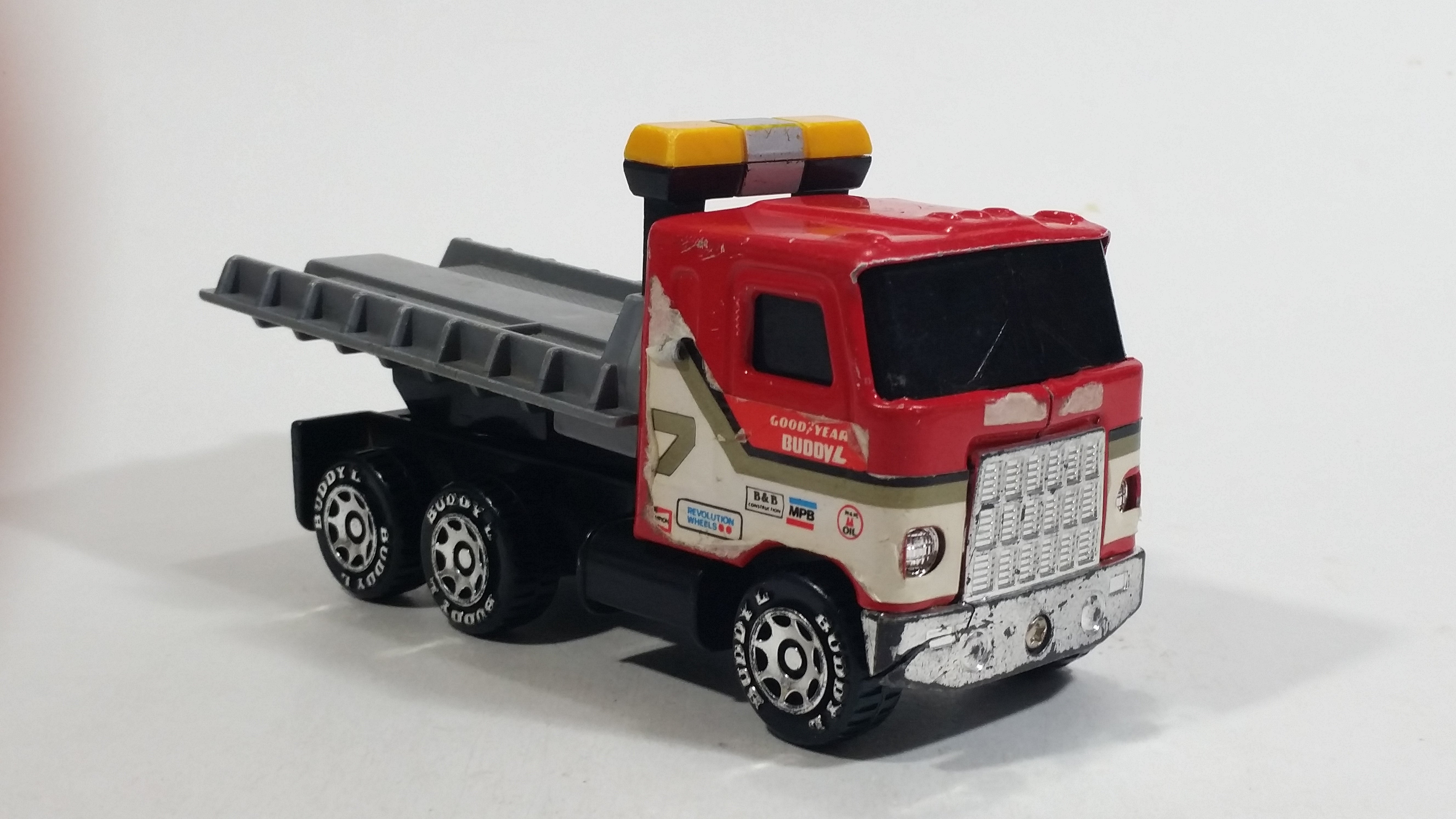 Vintage 1980 Buddy L Mack Semi Good Year #7 Flatbed Tow Truck Red and Grey Pressed Steel and Plastic Toy Car Wrecking Salvage Vehicle - Macau 7