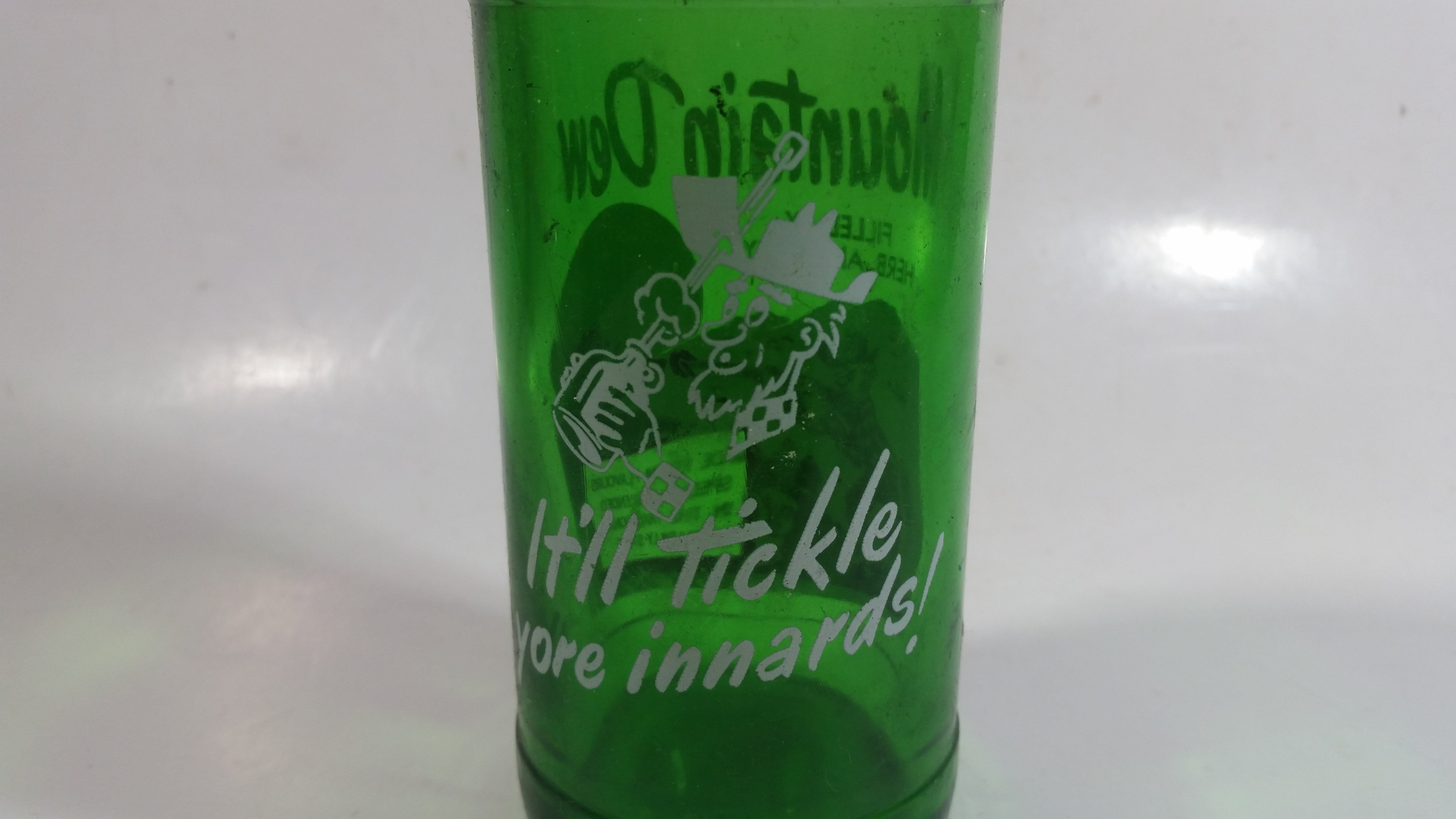 Vintage 1960s Mountain Dew Filled By Herb and Ruby "Hillbilly Style" Green Glass Soda Pop Beverage Bottle "It'll tickle your innards!" 4