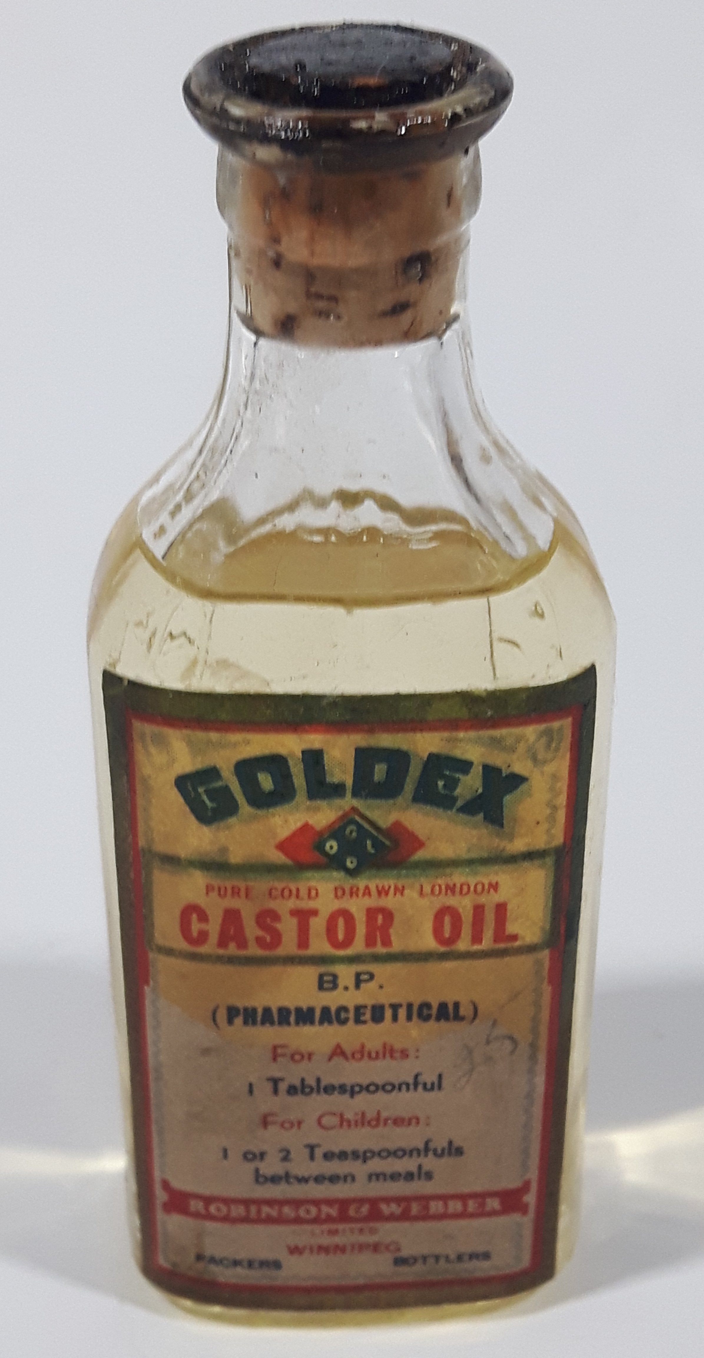 Antique Robinson & Webber Limited Winnipeg Packers Bottlers B.P. Pharmaceutical Goldex Gold Pure Cold Drawn London Castor Oil 4 1/2" Tall Glass Bottle with Cork Still FULL 12