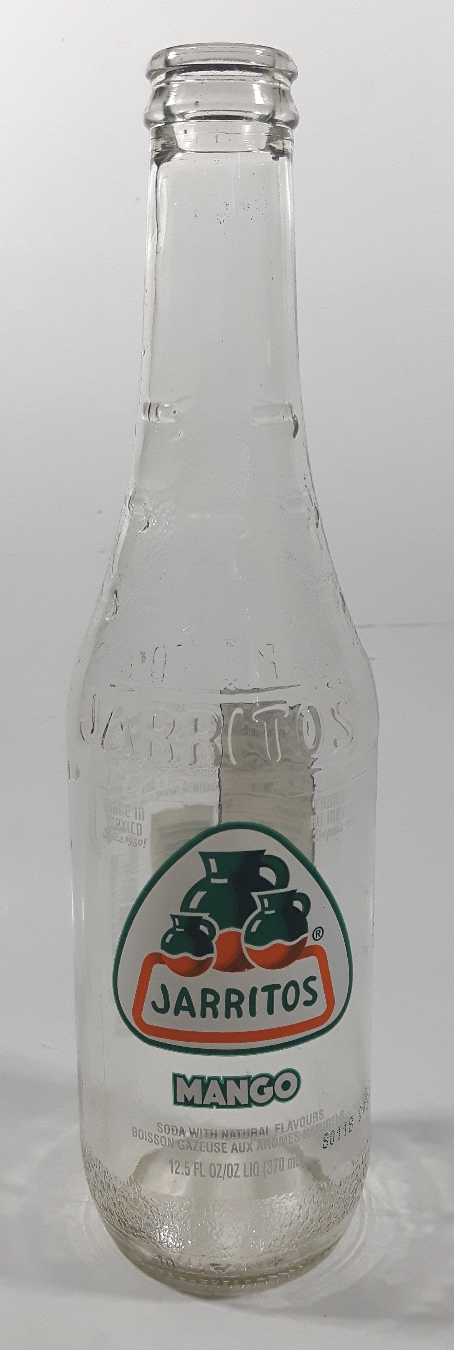 Jarritos Mango 9 1/4" Tall 370mL 12.5 Fl Oz. Embossed Clear Glass Soda Pop Bottle