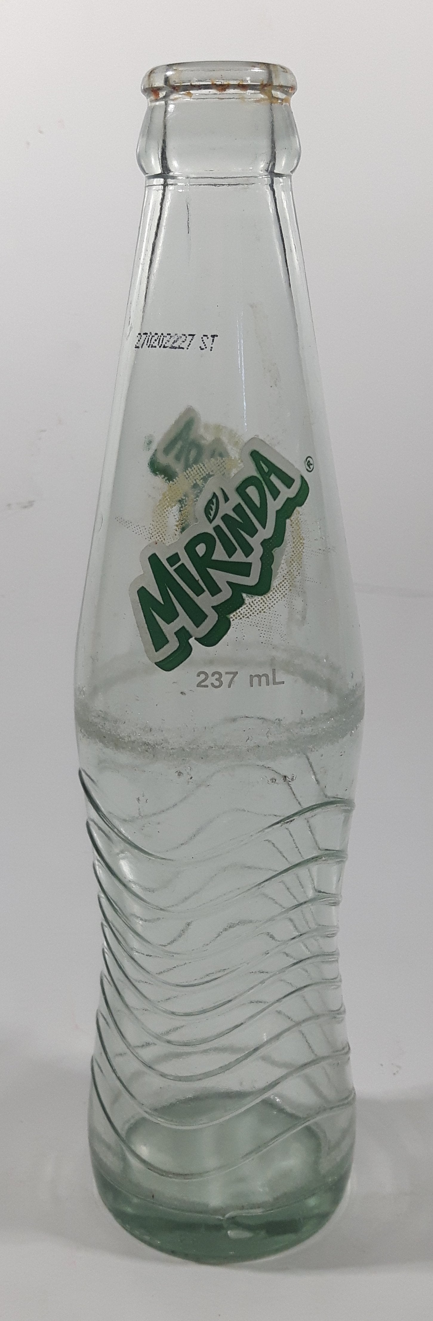 Mirinda 8 3/4" Tall 237mL Embossed Clear Glass Soda Pop Bottle