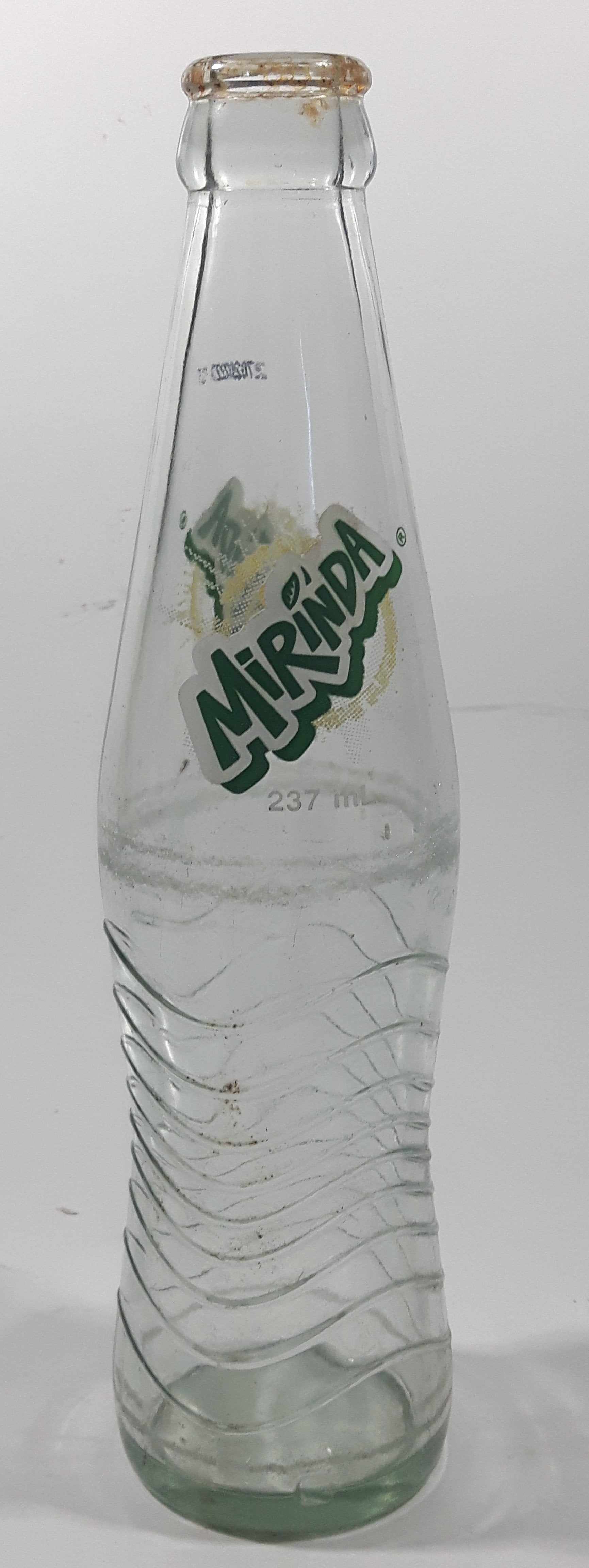 Mirinda 8 3/4" Tall 237mL Embossed Clear Glass Soda Pop Bottle