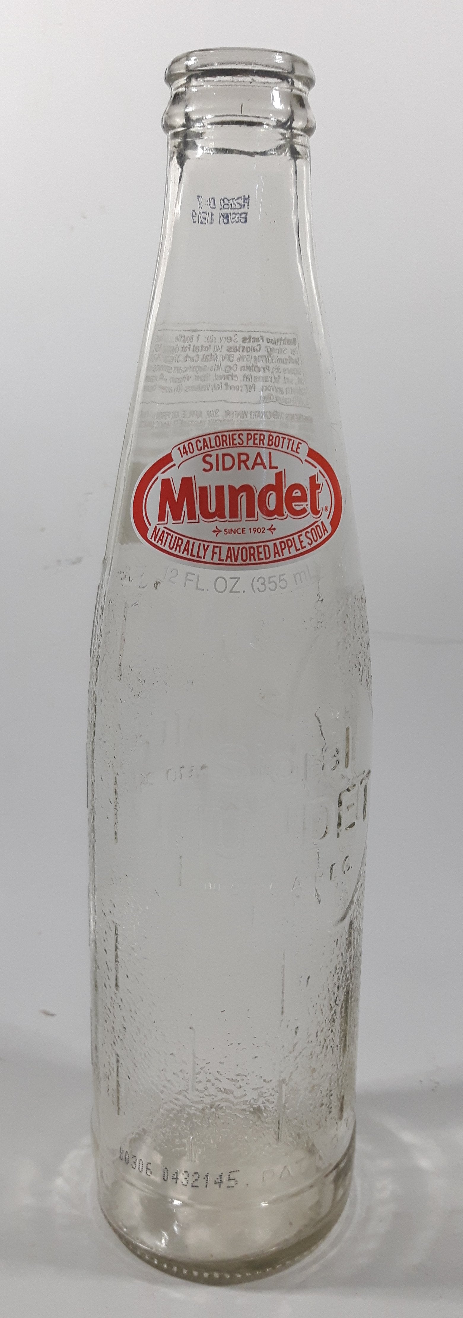 Sidral Mundet 9 1/4" Tall 12 Fl Oz 355mL Embossed Clear Glass Soda Pop Bottle