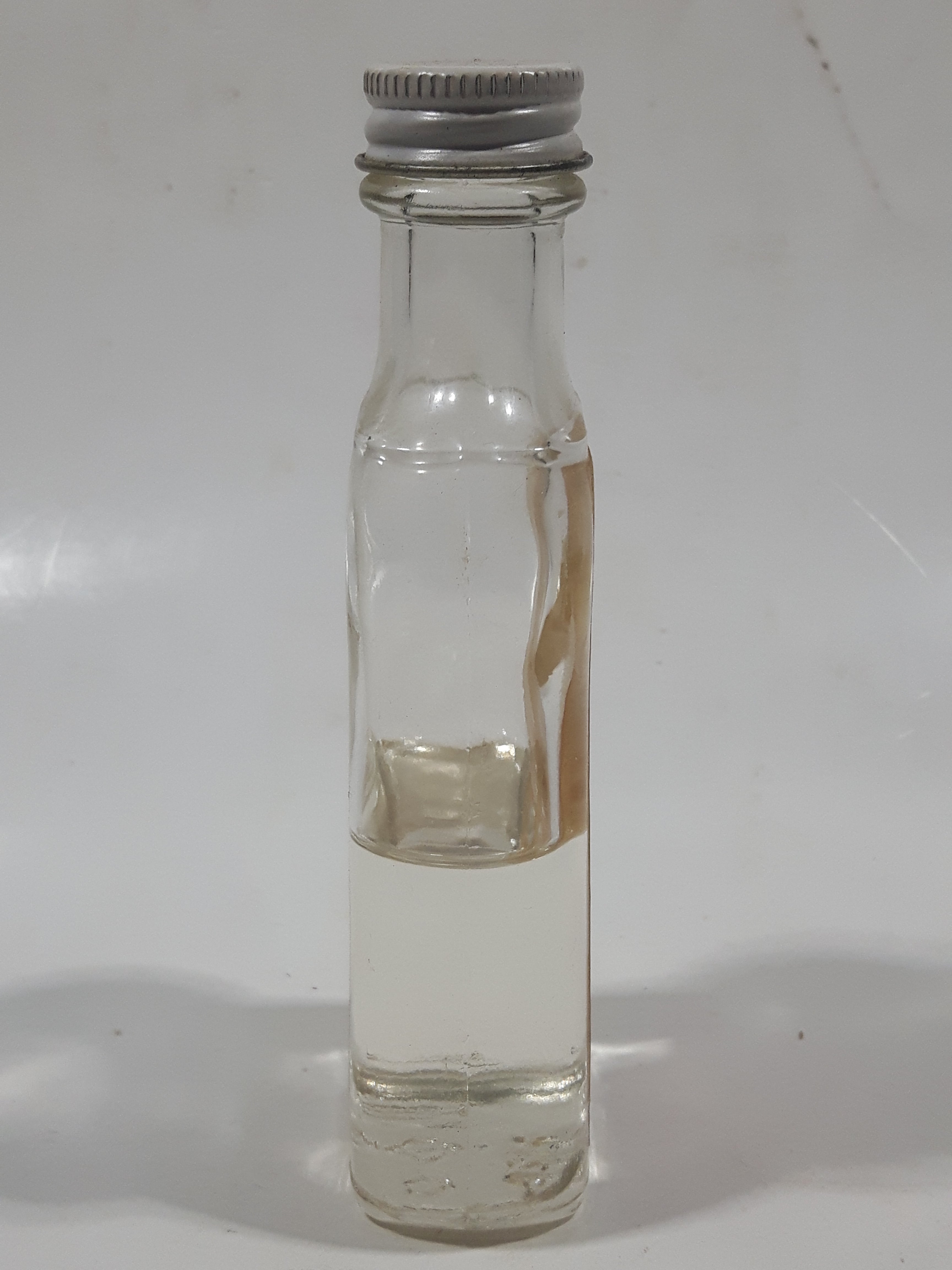Vintage Empress Pure Almond Extract 2 FL Oz. 4 1/2" Tall Glass Spice Jar Half Full 4