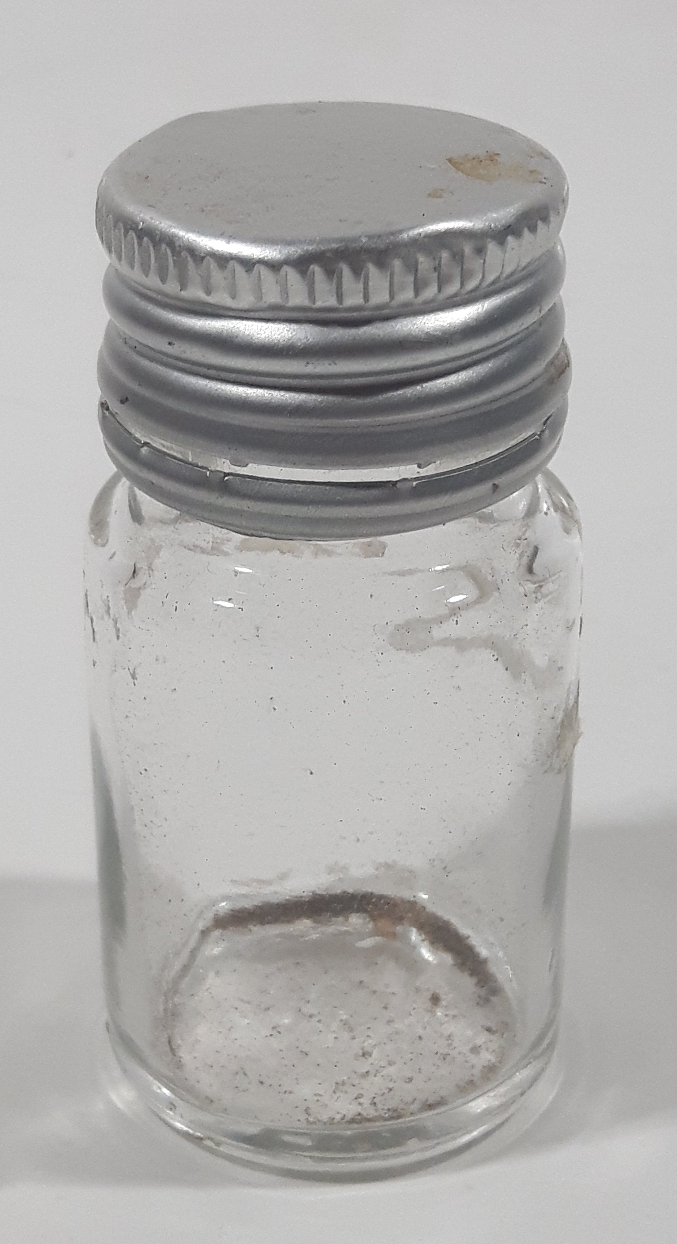 Vintage T-22 2 1/2" Tall Clear Glass Medicine Bottle with Metal Lid 10