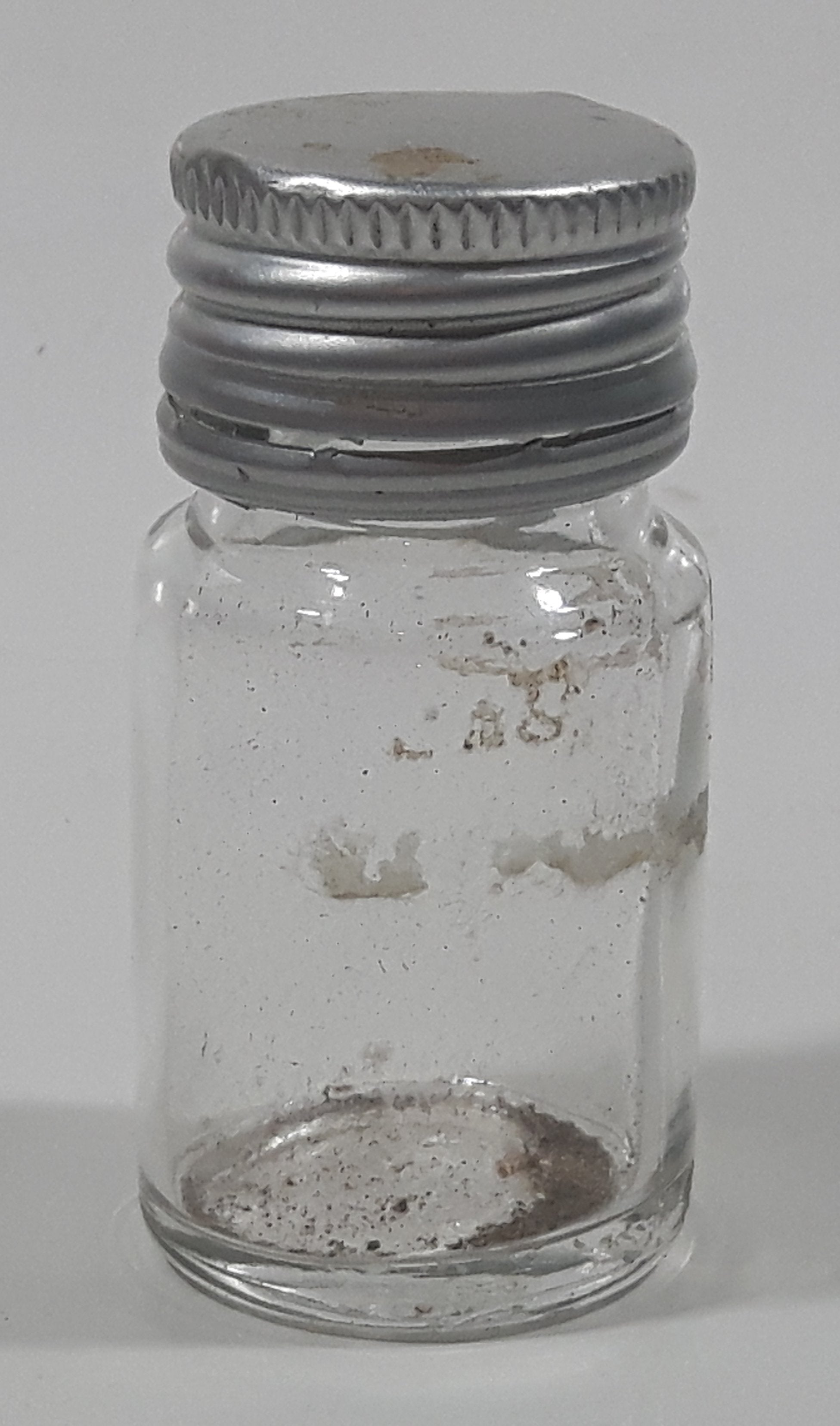 Vintage T-22 2 1/2" Tall Clear Glass Medicine Bottle with Metal Lid 2
