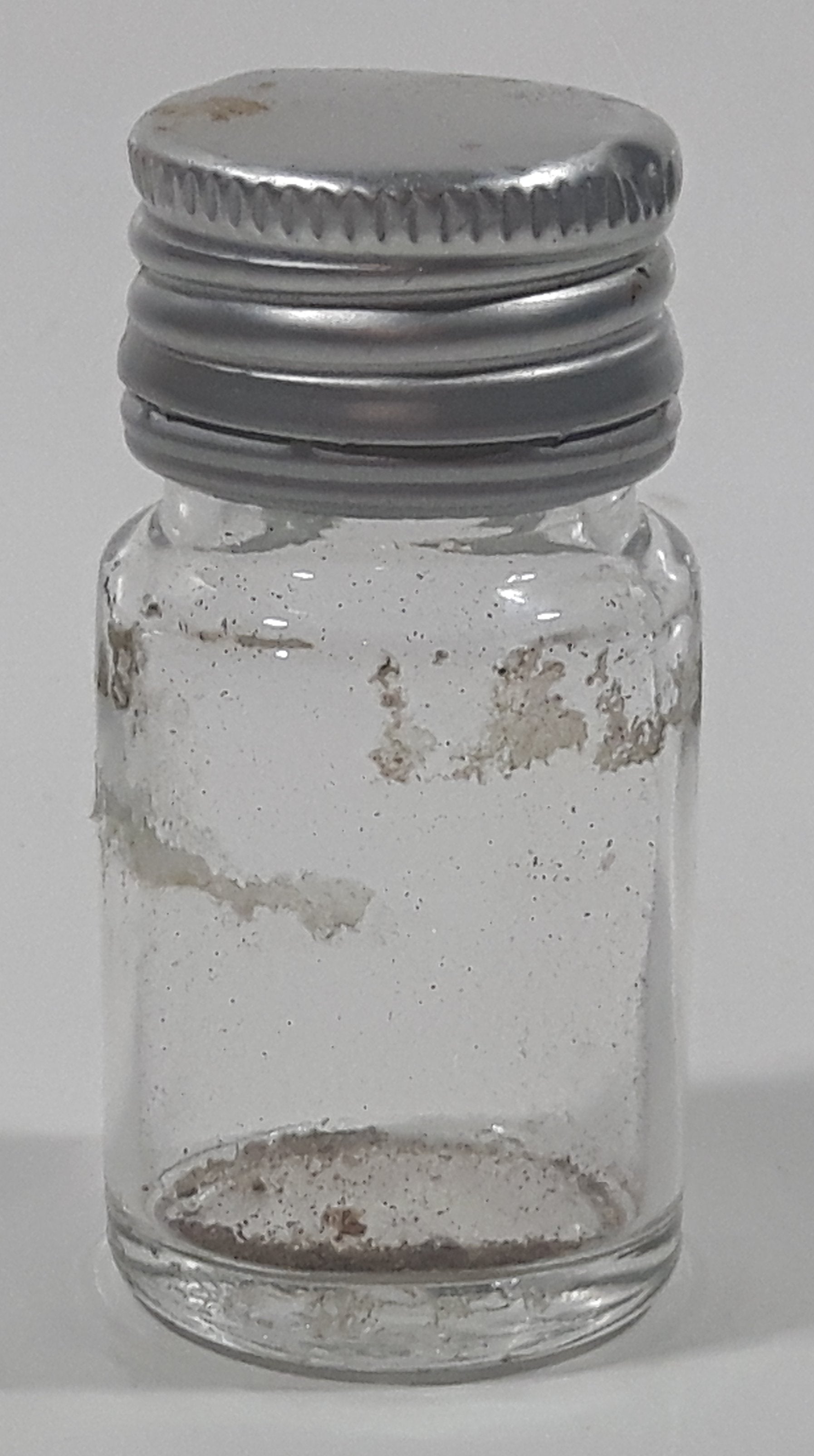 Vintage T-22 2 1/2" Tall Clear Glass Medicine Bottle with Metal Lid 3