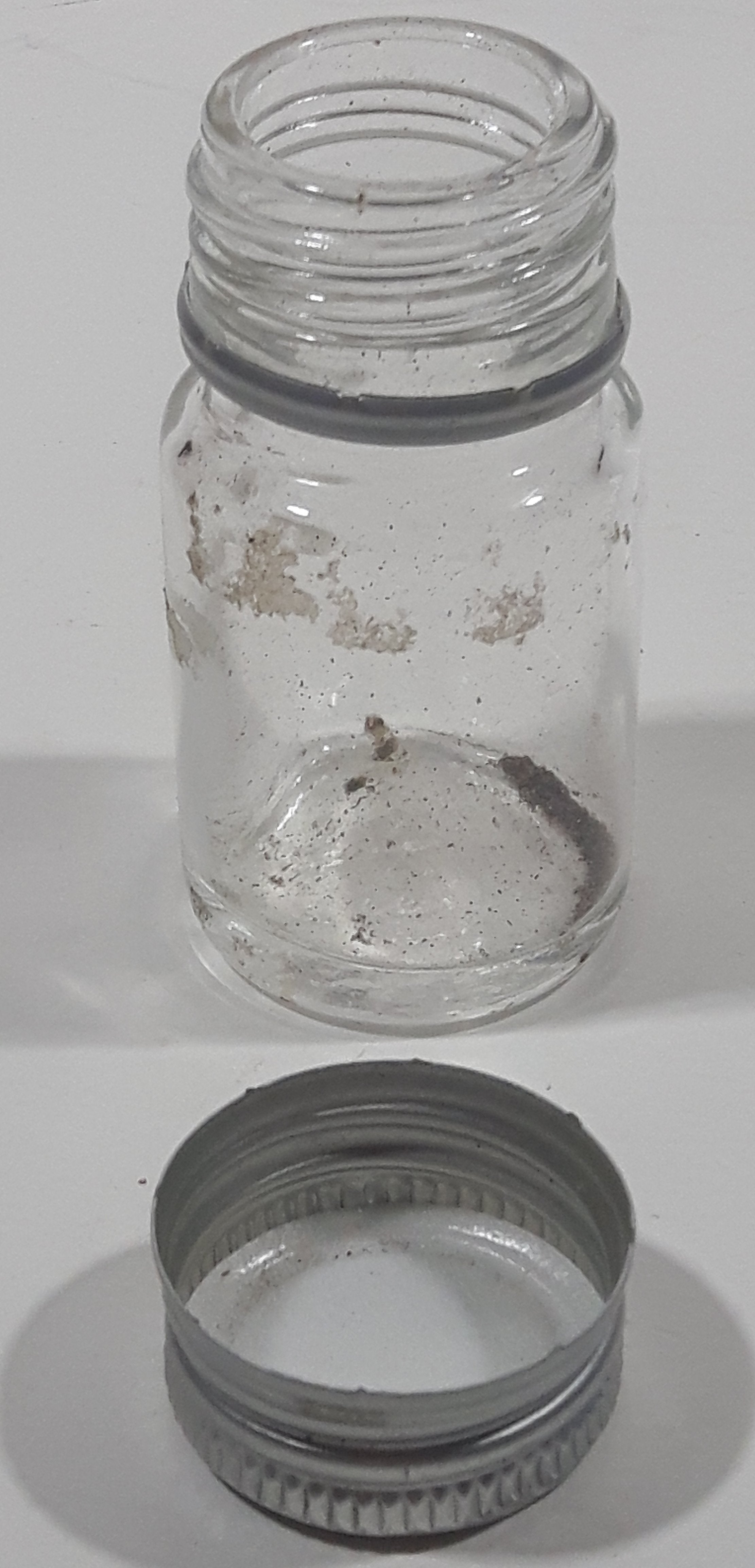 Vintage T-22 2 1/2" Tall Clear Glass Medicine Bottle with Metal Lid 6
