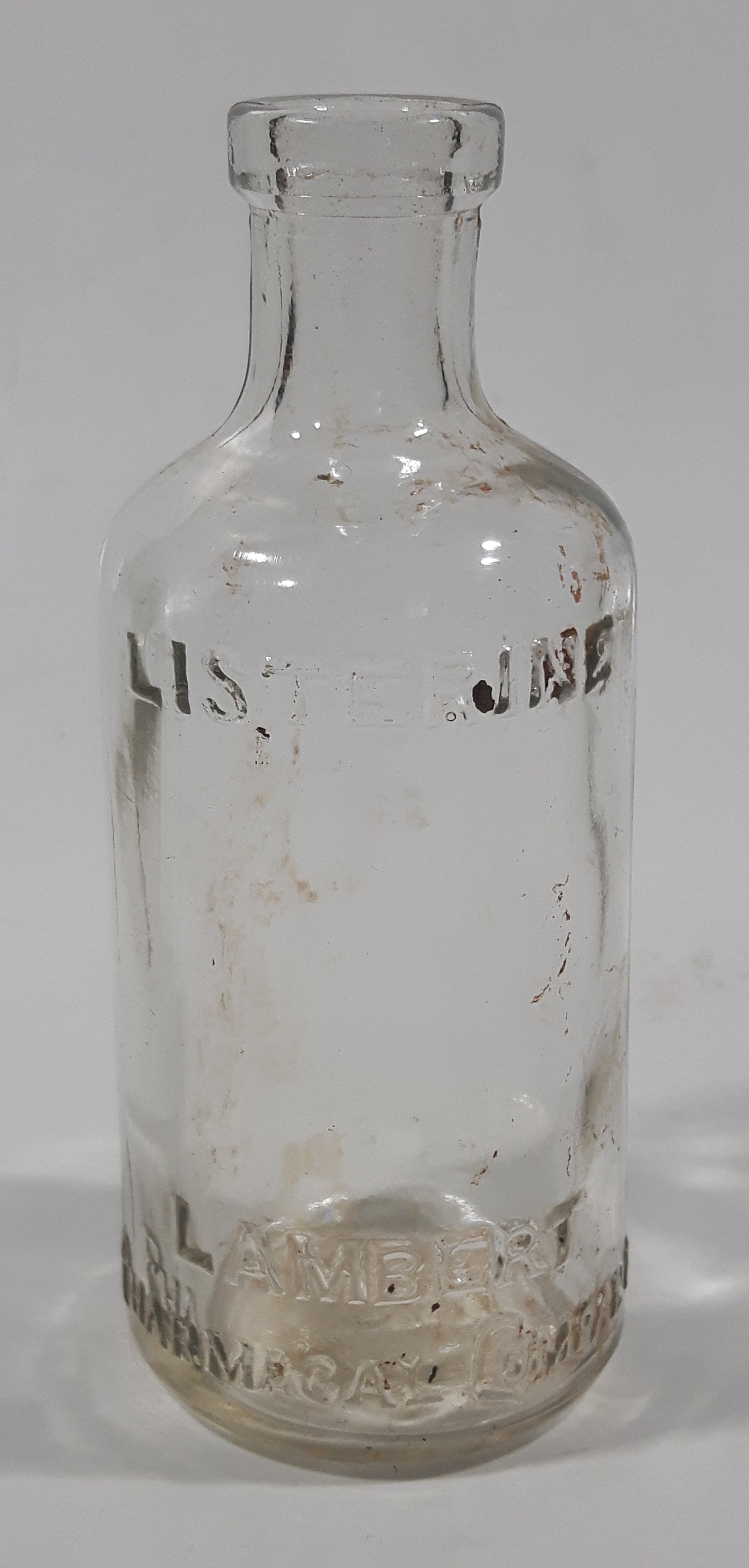 Antique Lambert Pharmacal Company Listerine 4 1/4" Tall Embossed Lettering Cork Top Glass Bottle