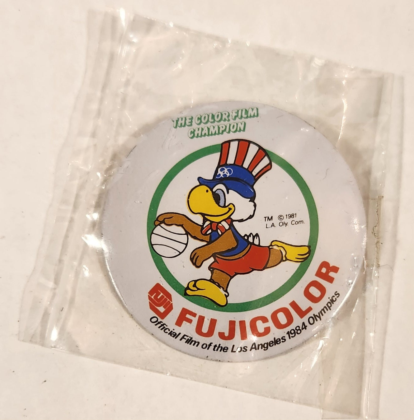 1981 L.A. Oly. Com. Fujicolor The Color Film Champion Official Film of the Los Angeles 1984 Olympics Sam The Eagle 1 3/4" Round Metal Pin New in Package
