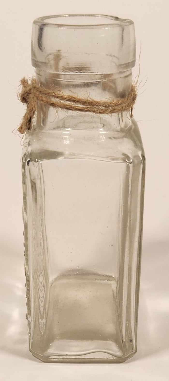 Vintage Kuowow's Powder Heavy Embossed Glass Bottle 2