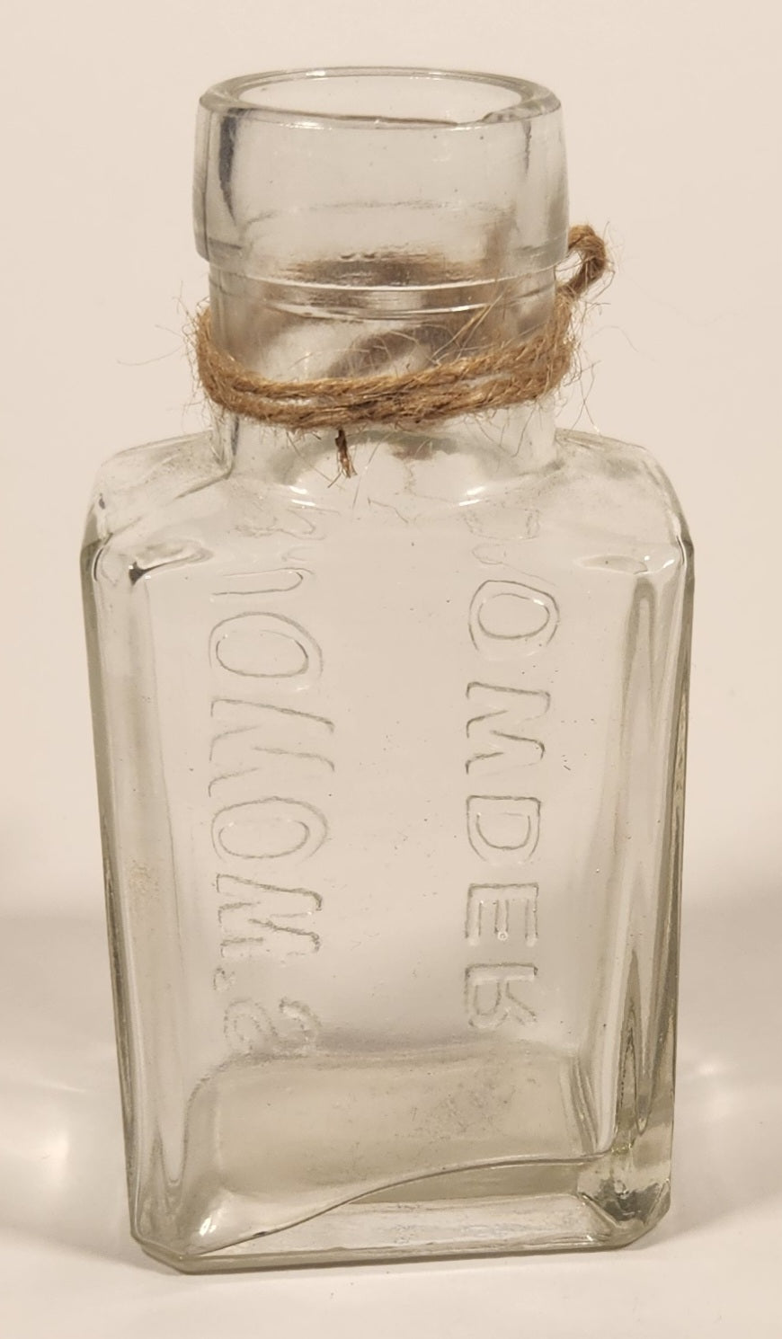 Vintage Kuowow's Powder Heavy Embossed Glass Bottle 3
