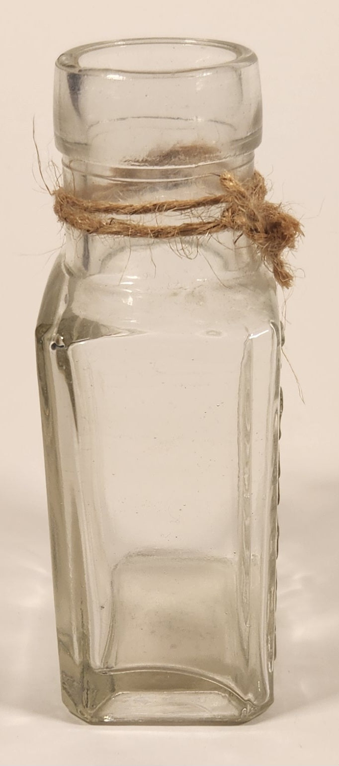 Vintage Kuowow's Powder Heavy Embossed Glass Bottle 4