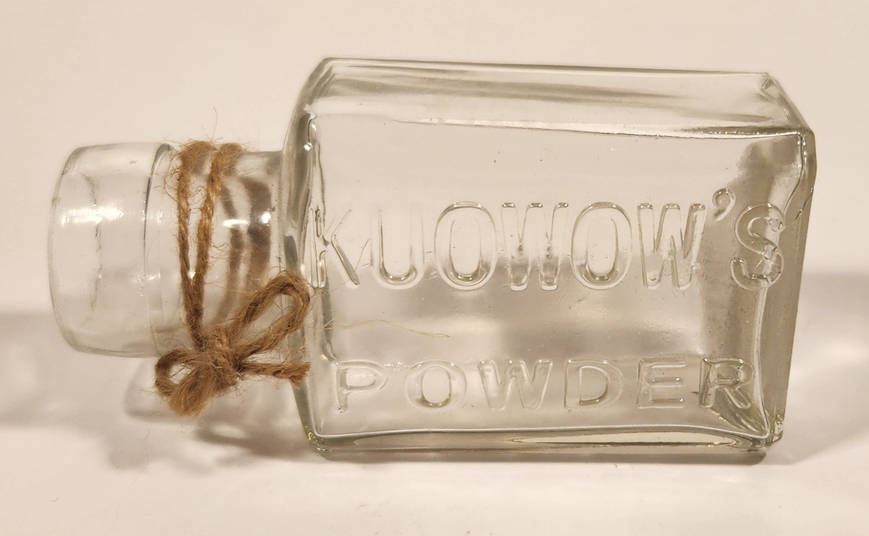 Vintage Kuowow's Powder Heavy Embossed Glass Bottle 5
